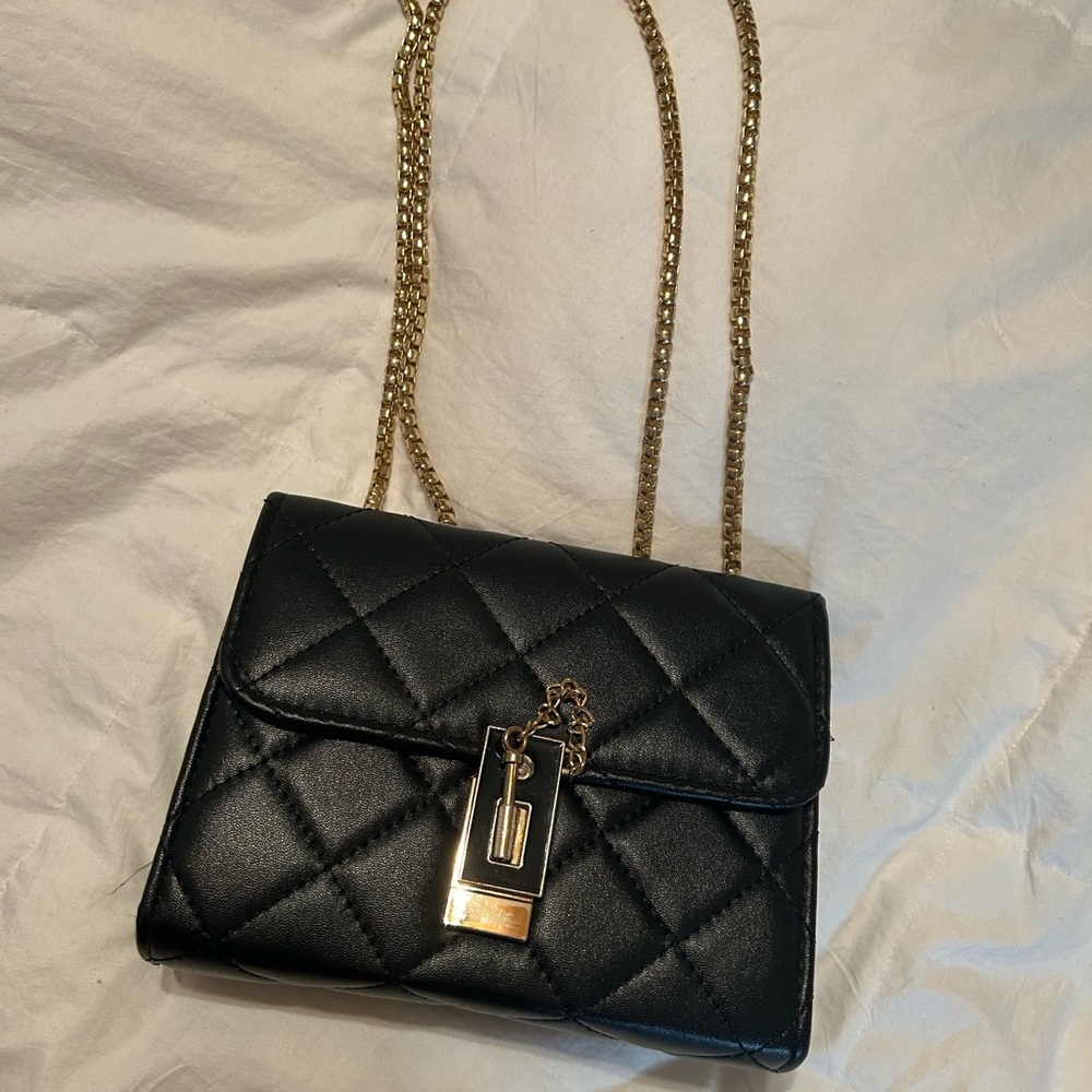 Black quilted purse with gold hardware